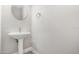 Bathroom featuring pedestal sink, tile floors, modern lighting and a round mirror at 14362 San Domingo Blvd, Port Charlotte, FL 33981