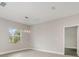 Bright dining room with elegant chandelier, wood-look flooring, and neutral wall colors at 14362 San Domingo Blvd, Port Charlotte, FL 33981