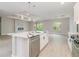 Modern open-plan kitchen with pendant lighting, stainless steel appliances, and eat in island at 14362 San Domingo Blvd, Port Charlotte, FL 33981