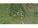 Secluded residence featuring lush forestry, privacy, and seclusion within a peaceful, natural landscape at 11933 Pasco Trails Blvd, Spring Hill, FL 34610