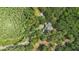 Secluded home featuring lush, mature trees providing privacy for a picturesque retreat away from the city at 11933 Pasco Trails Blvd, Spring Hill, FL 34610