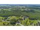 Overhead aerial view highlighting the lush greenery and landscaping at 11933 Pasco Trails Blvd, Spring Hill, FL 34610