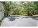 Large driveway with a picnic area in a lush outdoor setting at 11933 Pasco Trails Blvd, Spring Hill, FL 34610