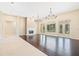 Spacious living area with dark wood floors, fireplace, and french doors at 11933 Pasco Trails Blvd, Spring Hill, FL 34610