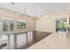 Open floor plan features hardwood flooring and lots of natural light at 11933 Pasco Trails Blvd, Spring Hill, FL 34610