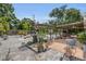 Spacious backyard with a patio, pergola, gravel, and lush landscaping at 6012 1St W Ave, Bradenton, FL 34209
