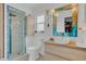Modern bathroom with a glass-enclosed shower, stylish vanity, and contemporary fixtures at 6012 1St W Ave, Bradenton, FL 34209
