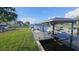 Dock and boat lift on the water provide convenient access for boating at 3510 Magnolia Way, Punta Gorda, FL 33950