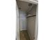 Walk-in closet featuring a built-in clothes rod and tile flooring at 3510 Magnolia Way, Punta Gorda, FL 33950
