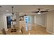 Spacious dining room with tile floors, modern lighting, and easy access to the outdoors at 3510 Magnolia Way, Punta Gorda, FL 33950