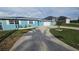 Lovely one-story home with well-maintained lawn, a large concrete driveway, and a two-car garage at 3510 Magnolia Way, Punta Gorda, FL 33950
