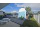 Backyard view of the shed, landscaping, and canal at 3510 Magnolia Way, Punta Gorda, FL 33950