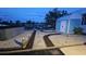 Evening view of the shed and landscaping on the canal at 3510 Magnolia Way, Punta Gorda, FL 33950