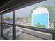 Enclosed porch view of the canal and shed, with outdoor seating at 3510 Magnolia Way, Punta Gorda, FL 33950
