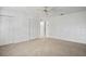 This spacious bedroom features a ceiling fan and double closets at 6049 Patricia Pl, Weeki Wachee, FL 34607