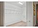 Walk-in closet with adjustable wire shelving for ample storage space at 6049 Patricia Pl, Weeki Wachee, FL 34607
