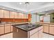 Eat-in kitchen featuring an island and sleek countertops at 6049 Patricia Pl, Weeki Wachee, FL 34607