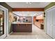 Spacious kitchen featuring an island with a granite countertop and stainless steel appliances at 6049 Patricia Pl, Weeki Wachee, FL 34607