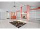 Vaulted ceiling living room with tiled floors and a decorative fireplace at 6049 Patricia Pl, Weeki Wachee, FL 34607