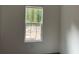 Bedroom with window overlooking backyard at 11876 Keylime Dr, New Port Richey, FL 34654