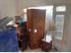 Room with wooden cabinet and window at 5737 Michigan Ave, New Port Richey, FL 34652