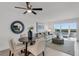 Modern dining area with a round table and four chairs, overlooking scenic water views at 8150 Brent St # 734, Port Richey, FL 34668