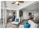 Relaxing sunroom with comfy seating and sliding glass doors leading to a balcony at 8150 Brent St # 734, Port Richey, FL 34668