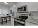 Modern kitchen with stainless steel appliances and granite countertops at 8150 Brent St # 734, Port Richey, FL 34668