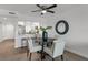 Modern dining area with a round table and four chairs near kitchen at 8150 Brent St # 734, Port Richey, FL 34668