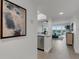 Bright and airy entryway with a view into the living area and kitchen at 8150 Brent St # 734, Port Richey, FL 34668