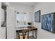 Small home office with a desk, chair, and artwork at 8150 Brent St # 734, Port Richey, FL 34668