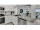 Updated kitchen with granite countertops and stainless steel appliances at 8150 Brent St # 734, Port Richey, FL 34668