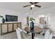 Modern dining area with a round table and four chairs, open to the kitchen at 8150 Brent St # 734, Port Richey, FL 34668