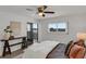 Bedroom with water views, a comfortable bed, and private balcony access at 8150 Brent St # 734, Port Richey, FL 34668