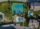 Aerial view showing tennis courts, pool, and community at 8150 Brent St # 734, Port Richey, FL 34668