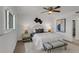 Bright bedroom with a comfortable bed, wood floors, and window views at 8150 Brent St # 734, Port Richey, FL 34668