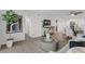Living room with contemporary furniture and large windows offering natural light at 8150 Brent St # 734, Port Richey, FL 34668