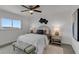 Bright bedroom with a comfortable bed, wood floors, and window views at 8150 Brent St # 734, Port Richey, FL 34668
