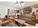 Living room with brown couches and American flag decor at 1026 Roosevelt Ave, Spring Hill, FL 34604