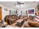 Living room with brown couches and American flag decor at 1026 Roosevelt Ave, Spring Hill, FL 34604