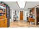 Home office with built-in shelving and wood flooring at 1026 Roosevelt Ave, Spring Hill, FL 34604