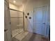 Bathroom showing a glass enclosed shower with white subway tile and neutral decor at 3270 Francoa Dr, Odessa, FL 33556