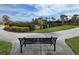 A park bench faces a view of a lovely community playground for Gathering time and neighborhood gatherings at 3270 Francoa Dr, Odessa, FL 33556