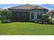 Single-story house with tile roof and a well manicured lawn at 3270 Francoa Dr, Odessa, FL 33556