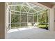 Peaceful screened porch overlooking the backyard at 1383 Dartford Dr, Tarpon Springs, FL 34688
