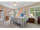 Comfortable bedroom with a queen-size bed and access to the patio at 1383 Dartford Dr, Tarpon Springs, FL 34688