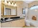 Elegant bathroom with granite countertop and large mirror at 1383 Dartford Dr, Tarpon Springs, FL 34688