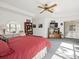 Main bedroom with king bed, built-in shelving, and backyard access at 8440 Maybelle Dr, Weeki Wachee, FL 34613