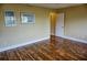 Spacious bedroom featuring wood flooring and natural light at 1873 Mazo Mnr # T5, Lutz, FL 33558
