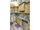 Kitchen featuring stainless steel appliances, wood cabinetry and granite countertops at 1873 Mazo Mnr # T5, Lutz, FL 33558
